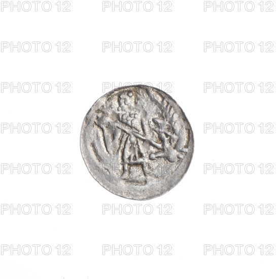 Denarius of Boleslaw III Krzywousty (prince of Poland; 1086–1138). Obverse: in the beaded border, a knight in chain mail thrusting a spearhead into the jaws of an upside-down dragon. Reverse: in the triple beaded border, an isosceles cross topped with balls; between its arms, one ball (one with a dot). Allegorical imagery: knights, martyrs, dragons, fight between good and evil, fight against pagans; possible reference to Saint Adalbert (ca. 956–997). Romanesque style. Issue mark: spearhead. Date: ca. 1125–1138. Place: Kraków, Poland. Coin; diameter 12.4–12.9 mm; weight 0.32 g.