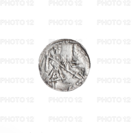 Denarius, Boleslaw III Krzywousty (prince of Poland; ca. 1107–1138). Obverse: in the beaded border, a knight in chain mail thrusting a spearhead into the jaws of a dragon turned upside down. Reverse: in the triple beaded border, an isosceles cross topped with spheres (one with a dot); between its arms, nearer the center one dot, nearer the ends sun symbols (two with one dot each). Iconography: spearhead, chain mail, equal-armed cross, knight, dragon, jaws, martyrs, fight between good and evil / fight against pagans; Romanesque style; reference to Saint Adalbert. Date: ca. 1125–1138. Place: Poland, Kraków. Object: coin (denarius). Diameter: 12.1–12.3 mm. Weight: 0.38 g.