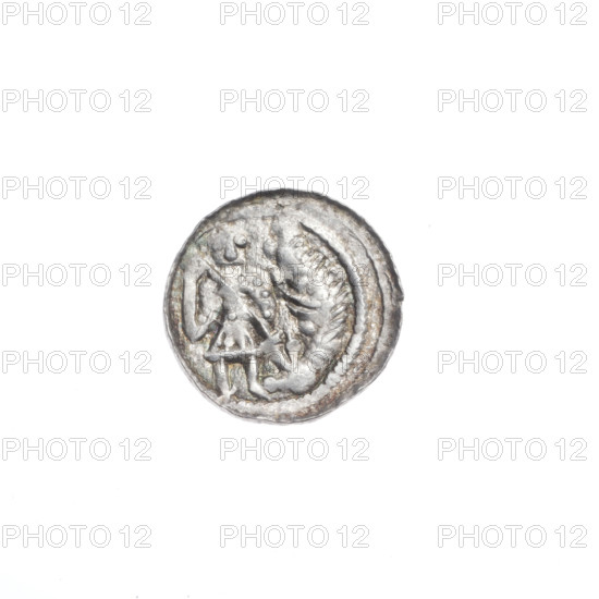 Denarius, Boleslaw III Krzywousty (prince of Poland; 1086–1138). Obverse: in a beaded border, a knight in chain mail thrusting a spearhead into the jaws of an upside-down dragon. Reverse: in a triple beaded border, an isosceles cross topped with balls; between its arms, in two quarters radiating two balls each (smaller ones closer to the center, larger ones farther), in the other two quarters one ball each. Iconography: spearhead, chain mail, equal-armed cross, dragons, knights, mouths, spears; themes of martyrs, fight between good and evil, fight against pagans; Romanesque style; depiction associated with Saint Adalbert (ca. 956–997). Date ca. 1125–1138. Poland, Kraków. Coin. Diameter 12.1–12.5 mm. Weight 0.53 g.