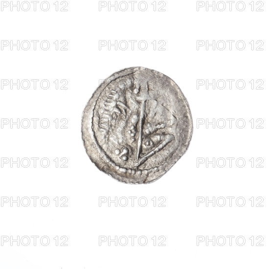 Denarius, Boleslaw III Krzywousty (prince of Poland; 1086–1138). Obverse: in the beaded border, a knight in chain mail thrusting a spearhead into the jaws of an upside-down dragon. Reverse: in the triple beaded border, an isosceles cross topped with spheres (two with one dot each); between its arms, in one quarter two radiating spheres (one smaller, one larger), and in the three remaining quarters one sphere each. Iconography: spearhead, chain mail, crosses, jaws, equal-armed cross, knight, dragon, martyrs, Adalbert (Saint; ca. 956–997), spear(s), fight between good and evil, fight against pagans; Romanesque style; Middle Ages. Attributed date ca. 1125–1138. Poland, Kraków. Coin (denarius). Diameter 12.7–13.5 mm. Weight 0.61 g.