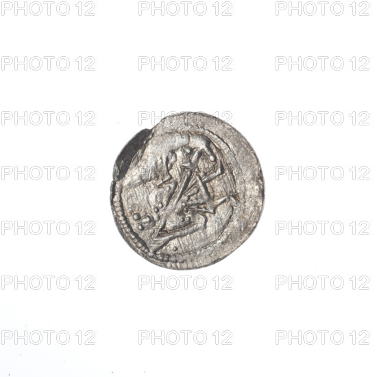denarius, Boleslaw III Krzywousty (prince of Poland; 1107–1138), allegories, Boleslaw III Krzywousty (prince of Poland; 1086–1138), crosses, equal-armed cross, spearhead (issue mark), chain mail, mouth, martyrs, knight, dragons, Romanesque (style), knights, dragon, Middle Ages, fight between good and evil, fight against pagans, spear, Adalbert (Saint; ca. 956–997), spears. Obverse: in the beaded border, a knight in chain mail thrusting a spearhead into the jaws of an upside-down dragon; a ball under the knight's right elbow; a dot outside the knight's right hand. Reverse: in the triple beaded border, an isosceles cross topped with balls, one ball between its arms. ca. 1125–1138. Kraków, Poland. Coin. Diameter 12.3–13.1 mm. Weight 0.35 g.
