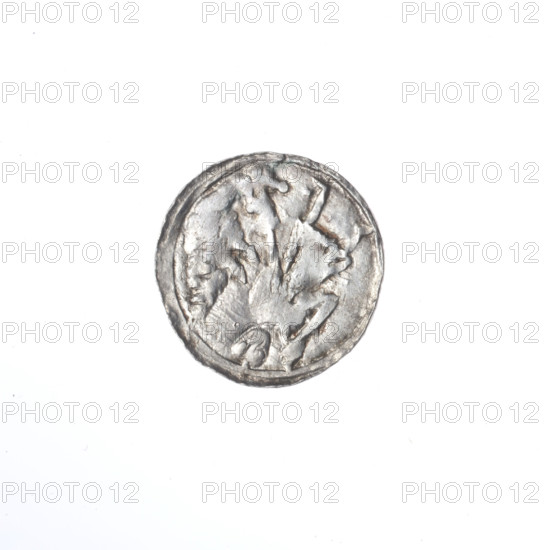 denarius, Boleslaw III Krzywousty (prince of Poland; 1086–1138; ruler 1107–1138), Romanesque style, ca. 1125–1138, Poland, Kraków; coin. Obv.: in the linear border, a knight in chain mail thrusting a spearhead into the jaws of an upside-down dragon. Rv.: in the triple beaded border, an isosceles cross topped with balls (one with a dot); between its arms, a ball. Motifs/attributes: allegories, equal-armed cross, chain mail, crosses, spearhead (issue mark), martyrs, jaws, knight, dragons, knights, dragon, Middle Ages, fight between good and evil, fight against pagans, Adalbert (Saint; ca. 956–997), spear, spears. Diameter 12.9–13.2 mm; weight 0.49 g.
