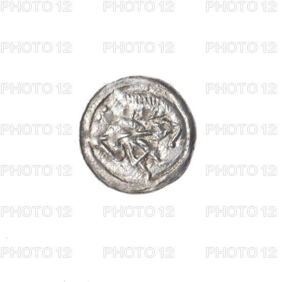 Denarius, Boleslaw III Krzywousty (prince of Poland; 1086–1138). Obverse: in the beaded border, a knight in chain mail thrusting a spearhead into the jaws of an upside-down dragon. Reverse: in the triple beaded border, an isosceles cross topped with balls (two with one dot each); between its arms are balls (three with one dot each; possible fourth obscured by surface effacement). Iconography: spearhead, equal-armed cross, crosses, chainmail, martyrs, jaws, knight, dragon; themes of fight between good and evil and fight against pagans. Style: Romanesque, Middle Ages. Associated figure: Adalbert (Saint; ca. 956–997). Date: ca. 1125–1138. Place: Poland, Kraków. Object: coin (denarius). Diameter: 12.8–13.2 mm. Weight: 0.35 g. State of preservation: very good.