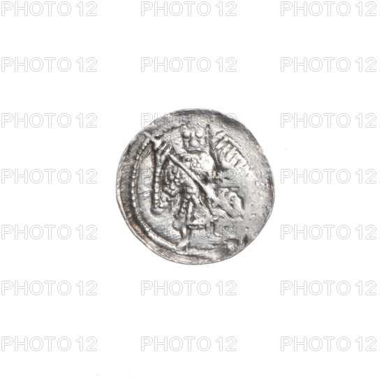 Denarius, Boleslaw III Krzywousty (prince of Poland; 1086–1138). Romanesque style coin, ca. 1125–1138, Poland, Kraków. Obverse: in a beaded border, a knight in chain mail thrusting a spearhead into the jaws of an upside-down dragon — allegory of the fight between good and evil, martyrs, knights, dragons, fight against pagans; imagery references Adalbert (Saint; ca. 956–997). Reverse: in a triple beaded border, an isosceles cross topped with balls; between its arms one dot closer to the center and one sun closer to the ends. Issue mark: spearhead. Material: coin. Diameter 12.6–12.8 mm; weight 0.35 g.