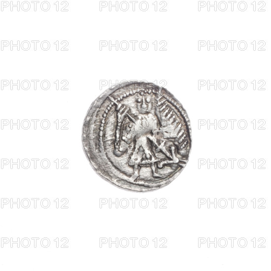 Denarius, Boleslaw III Krzywousty (prince of Poland; 1086–1138). Obverse: in a beaded border, a knight in chain mail thrusting a spearhead into the jaws of a dragon turned upside down. Reverse: in a triple beaded border, an isosceles cross topped with spheres (one with a dot); between its arms, one sun (two of them with a dot). Allegories of martyrs, knight, dragons; themes: fight between good and evil, fight against pagans. Romanesque style. References to equal-armed cross, crosses, spear/spearhead, jaws, chain mail, Adalbert (Saint; ca. 956–997). Date: ca. 1125–1138. Place: Poland, Kraków. Coin; diameter 12.7–13.0 mm; weight 0.70 g. State of preservation: very good.