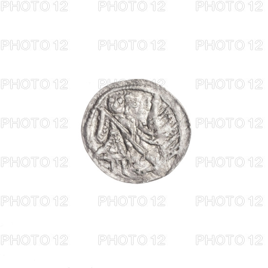 Denarius of Boleslaw III Krzywousty (prince of Poland; ca. 1107–1138). Obverse: in a beaded border, a knight in chain mail thrusting a spearhead into the jaws of an upside-down dragon. Reverse: in a triple beaded border, an isosceles cross topped with balls; between its arms, one dot closer to the center and one sun closer to the ends. Iconography: spearhead, allegories, crosses, chain mail, martyrs, equal-armed cross, mouth, Romanesque style, knights, dragon, fight between good and evil, fight against pagans, spear, Saint Adalbert (Adalbert, ca. 956–997). Date: ca. 1125–1138. Place: Kraków, Poland. Object type: coin (denarius). Diameter: 12.1–12.8 mm. Weight: 0.37 g.