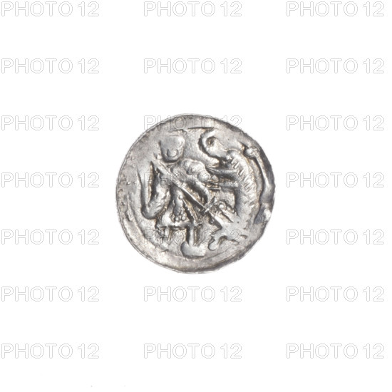 Denarius, Boleslaw III Krzywousty (prince of Poland; ca. 1086–1138). Obverse: in the beaded border, a knight in chain mail thrusting a spearhead into the jaws of an upside-down dragon. Reverse: in the triple beaded border, an isosceles cross topped with balls (three of them have one dot each; the fourth may as well—observation difficult due to wear). A dot at the crossing of the arms. Between them, one sun. Iconography: spearhead, chain mail, equal-armed cross, crosses, jaws, knight, martyrs, dragons; themes of Romanesque style, Middle Ages, Adalbert (Saint; ca. 956–997), fight between good and evil, fight against pagans. Date: ca. 1125–1138. Place: Kraków, Poland. Coin; diameter 12.6–12.9 mm; weight 0.60 g.