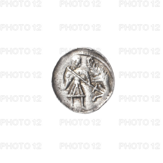 Denarius, Boleslaw III Krzywousty (prince of Poland; 1107–1138). Obverse: within a beaded border, a knight in chain mail thrusting a spearhead into the upside-down jaws of a dragon. Reverse: within a triple beaded border, an isosceles cross topped with spheres (one with a dot); at the crossing of the arms a dot; between the arms a sun (two suns with one dot). Allegorical Romanesque imagery of martyrs, knights, dragons; themes of Middle Ages fight between good and evil and fight against pagans; associated with Adalbert (Saint; ca. 956–997). Issue mark: spearhead. Date: ca. 1125–1138. Place: Kraków, Poland. Medium: coin (denarius). Diameter: 12.1–12.6 mm. Weight: 0.60 g.