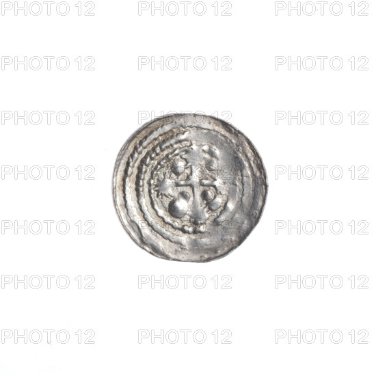 Denarius of Boleslaw III Krzywousty (prince of Poland; ca. 1125–1138). Obverse: in the beaded border, a knight in chain mail thrusting a spearhead into the jaws of an inverted dragon; a sun beneath the knight’s right elbow. Reverse: in the triple beaded border, an isosceles cross topped with suns; between its arms, two quarters each radiating two spheres (smaller ones closer to the center, larger ones farther), the other two quarters with one sphere each. Romanesque style; imagery includes allegories, knights, martyrs, fight between good and evil, dragon, spear (issue mark), chain mail. Inscription/identification: Boleslaw III Krzywousty (prince of Poland; 1086–1138). Date: ca. 1125–1138. Place: Poland, Kraków. Object: coin (denarius). Diameter: 12.1–12.7 mm. Weight: 0.38 g.