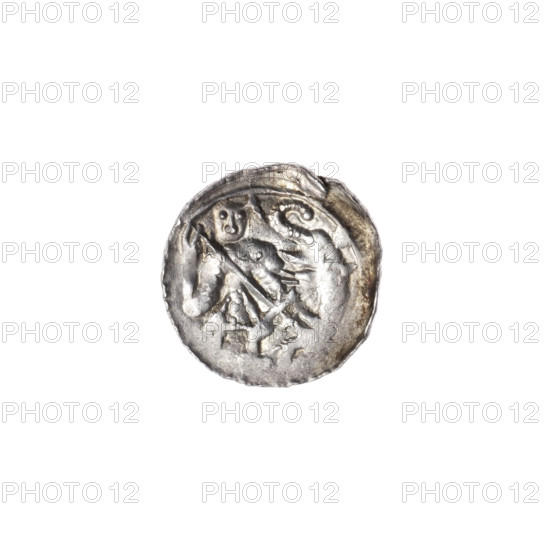 denarius, Boleslaw III Krzywousty (prince of Poland; 1086–1138 / reign 1107–1138), Romanesque, allegorical iconography: knight in chain mail thrusting a spearhead into the jaws of an upside-down dragon; dragons; knights; martyrs; Adalbert (Saint; ca. 956–997); fight between good and evil; fight against pagans; spear(s), spearhead, chain mail, equal-armed cross and crosses, jaws. Obverse: in a linear border, a knight in chain mail thrusting a spearhead into the jaws of an upside-down dragon. Reverse: in a triple beaded border, an isosceles cross topped with spheres (one with a dot), a dot at the crossing of the arms, and one sun between them. ca. 1125–1138. Poland, Kraków. Coin (denarius). Diameter: 12.1–12.9 mm. Weight: 0.53 g.