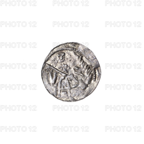 denarius, Boleslaw III Krzywousty (prince of Poland; 1086–1138), allegories, spearhead (issue mark), equal-armed cross (iconographic), crosses, jaws (iconographic), chain mail (iconographic), chain mails, martyrs, knight (iconographic), Romanesque (style), knights, dragon (iconographic), jaws, dragons, Middle Ages, fight between good and evil (iconographic), fight against pagans (iconographic), spear (iconographic), Adalbert (Saint; ca. 956–997). Obv.: in the beaded border, a knight in chain mail thrusting a spearhead into the jaws of a dragon turned upside down. Rv.: in the triple beaded border, an isosceles cross topped with balls; at the intersection of the arms, a ball; between them, one ball (two of them have one dot); one arm intersects the other at approximately 1/3 of its length. ca. 1125–1138, Kraków, Poland; coin; diameter 12.5–12.9 mm; weight 0.37 g.