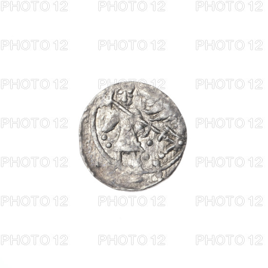 denarius, Boleslaw III Krzywousty (prince of Poland; 1086–1138), Romanesque, ca. 1125–1138, Poland, Kraków. Obverse: in a beaded border, a knight in chain mail thrusting a spearhead into the jaws of an upside-down dragon; under the knight's right elbow, three dots forming a triangle; under the left elbow, two vertical dots. Reverse: in an elliptical triple beaded border, an isosceles cross topped with balls (two of them with a single dot); between its arms, a single sun (one with a dot; other suns indistinct). Iconography: spearhead, crosses, equal-armed cross, chain mail, jaws, dragons, fight between good and evil, fight against pagans, Adalbert (Saint), martyrs, knights. Coin; diameter ~12.2–12.8 mm; weight 0.52 g.