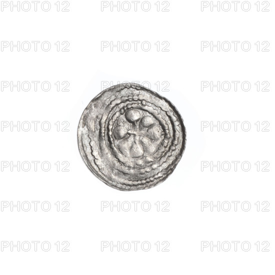 Denarius of Boleslaw III Krzywousty (prince of Poland; reign 1107–1138). Obverse: in a beaded border, a knight in chain mail thrusting a spearhead into the jaws of an upside-down dragon. Reverse: in a triple beaded border, an isosceles cross topped with balls; between its arms, one ball. Iconography: knight (martyr/Adalbert), dragons, fight against pagans, spears; Romanesque style. Date: ca. 1125–1138. Place: Kraków, Poland. Medium: coin. Diameter: 11.8–12.1 mm. Weight: 0.43 g. Maker/inscription: Jastrzebowski, Stanislaw (1898–1980) noted spearhead (issue mark).