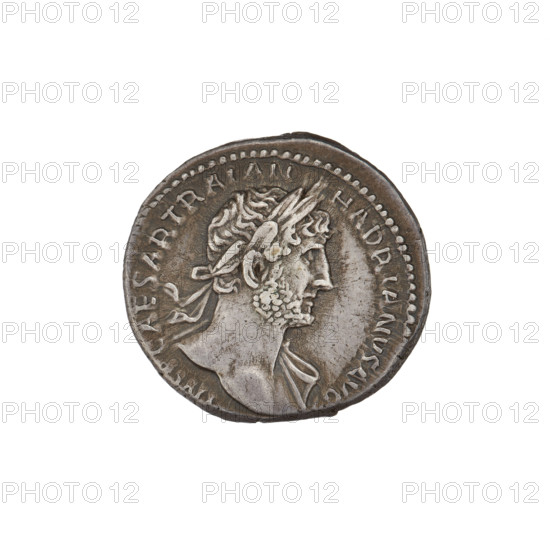 Denarius, Hadrian (76–138; Roman emperor 117–138). Obverse: bust of Hadrian with laurel wreath facing right; rim inscription: IMPCAESARTRAIANHADRIANVSAVG. Reverse: Mars striding right with spear and trophy; rim inscription: PM TR P COS III. Date: 119–122. Roman Empire (27 BC–476), Rome. Coin; diameters 17.0 mm and 18.0 mm; weight 3.52 g.