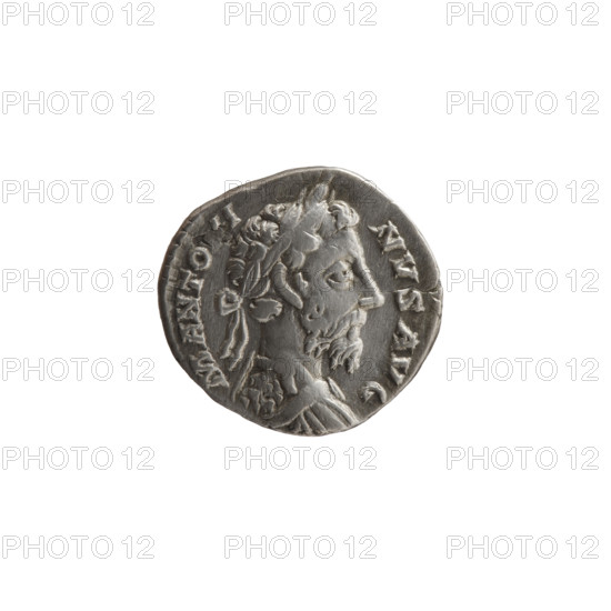 Denarius of Marcus Aurelius (121–180; Roman emperor 161–180), 177–180. Obverse: Bust of Marcus Aurelius in laurel wreath and armor facing right, inscription M ANTO, I - NVS AVG. Reverse: Roma seated on armor and shields facing left, holding Victory in his outstretched right hand and a dagger (parazonium) in his left hand, inscription CO - S - III PP. Roman Empire (27 BC–476). Coin; silver; diameter ~17–18 mm; weight 2.80 g; axis 0°.