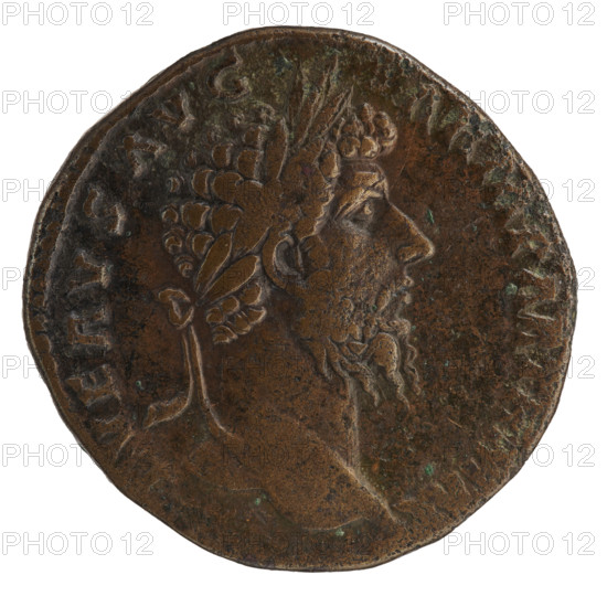 Sestertius of Lucius Verus (130–169), Roman emperor 161–169. Obverse: head of Lucius Verus in a laurel wreath facing right, inscription 'L VERVS AVG - ARM PARTH MAX'. Reverse: Victoria standing right, holding a palm branch in her right hand and supporting her left on a round shield inscribed 'VIC / PAR', attached to the trunk of a palm tree; inscriptions 'TR POT VI - IMP IIII COS II'; field marks 'S - C'. Date: 165–166. Roman Empire. Coin. Diameter: 29.5–31.0 mm. Weight: 28.40 g.