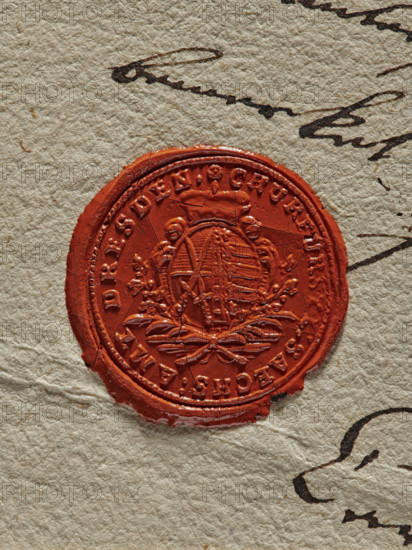 Circular wax impression of the seal of the office of the Elector of Saxony in Dresden. In the field of the seal, an oval crowned shield with the coat of arms of Saxony. The shield is bipartite with a column. The right field is bipartite with a black stripe at the top and a white stripe in the lower field, against this background two crossed swords. The left field with five gold and five black horizontal stripes and a diagonal stripe to the right. Below the shield, two crossed palm branches. In the rim an inscription: CHURFURSTE: SAECHS: AMT: DRESDEN. A second wax seal: decorative monogram FTL (Friedrich Traugoth Ludewig), 1794. Locations: Dresden; Elblag (Poland)., A circular red wax seal pressed onto textured beige paper, showing an embossed central motif with decorative elements and a raised rim, surrounded by dark ink cursive strokes on the paper; the seal surface has fine cracks and slight edge irregularities, and the visible colors include red, beige, dark brown, and a few darker ...