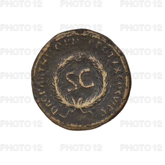 Trajan (53–117; Roman Emperor 98–117). Coin, 114–117 CE. Obverse: head of Trajan in radiant crown facing right; rim inscription 'IMP CAES NER TRAIANO OPTIMO AVG GERM'. Reverse: letters 'SC' surrounded by an oak wreath; rim inscription 'DAC PARTHICO PM TR POT XX COS VI PP'. Material: bronze? (weight 8.90 g). Origin: Cyprus, Roman Empire (27 BC–476). Oak wreaths, radiant crowns, heads.