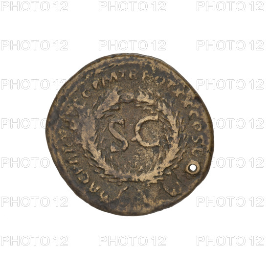 Countermarked, Trajan (53–117; Roman Emperor 98–117). Obverse: head of Trajan in radiant crown facing right; rim inscription: IMP CAES NER TRAIANO OPTIMO AVG GERM. Reverse: letters SC surrounded by an oak wreath; rim inscription: DAC PARTHICO PM TR POT XX COS VI PP. Bucranium countermark, probably made when Trajan's troops were retreating from Parthia. Pierced coin, 114–117 CE, Roman Empire (27 BCE–476 CE), Cyprus. Coin, weight 8.85 g.