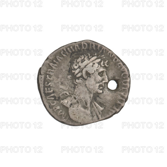 Denarius, Hadrian (76–138; Roman emperor 117–138). Obverse: bust of Hadrian right, laurel wreath in hair; rim inscription 'IMP CAES TRAIAN HADRIANO AVG DIVI TRA'. Reverse: Pietas standing left, wearing a long robe with draperies, right hand raised, left hand at chest; rim inscription 'PARTH F DIVI NER NEP PM TR P COS'; on both sides the inscription 'PIETAS'. Coin pierced through. Date: 117. Place: Rome, Roman Empire (27 BC–476). Medium: coin. Weight: 3.25 g.