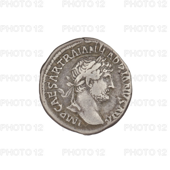 Denarius, Hadrian (76–138; Roman emperor 117–138). Obverse: bust of Hadrian with a laurel wreath facing right; rim inscription IMPCAESARTRAIANHADRIANVSAVG. Reverse: Minerva stands to the right, legs slightly apart, wearing a long dress and a helmet, pointing a spear downward in her raised right hand and holding a shield in her left; rim inscription PM TR P COS III. Date: 119–122. Place: Rome, Roman Empire (27 BC–476). Material: coin. Weight: 3.20 g.