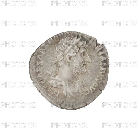Denarius, Hadrian (76–138; Roman emperor 117–138). Obverse: Bust of Hadrian with laurel wreath facing right; rim inscription: IMPCAESARTRAIANHADRIANVSAVG. Reverse: Roma seated left on a chair, wearing a long dress and helmet, holding a figure of Victoria in her outstretched right hand and a vertically placed spear in her left; rim inscription: PM TR P COS III. Date: 119–122. Rome, Roman Empire (27 BC–476). Coin; weight 3.10 g.