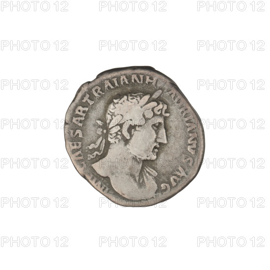 Denarius, Hadrian (76–138; Roman emperor 117–138). Obverse: Bust of Hadrian with laurel wreath facing right; rim inscription: IMPCAESARTRAIANHADR IANVSAVG. Reverse: Roma seated left on a chair, wearing a long robe and helmet; in her outstretched right hand she holds a figure of Victoria, in her left hand a vertical spear, with a shield behind her; rim inscription: PM TR P. Date: 119–122. Rome, Roman Empire (27 BC–476). Coin; weight 2.93 g.