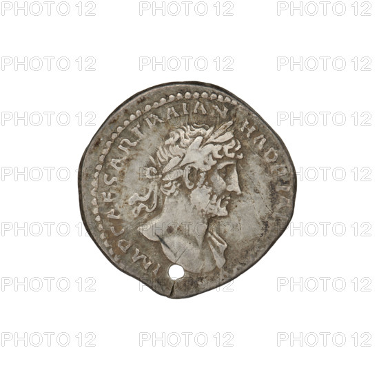 Denarius, Hadrian (76–138; Roman emperor 117–138). Obverse: Bust of Hadrian with laurel wreath facing right; rim inscription: IMPCAESARTRAIANHADRIAN. Reverse: Roma seated left on a chair, wearing a long dress and helmet, holding a figure of Victoria in her outstretched right hand, a vertical spear in her left, with a shield behind her; rim inscription: PM TR P COS III. Coin pierced through to make a pendant. Date: 119–122. Place: Rome, Roman Empire (27 BC–476). Material: coin. Weight: 2.95 g.