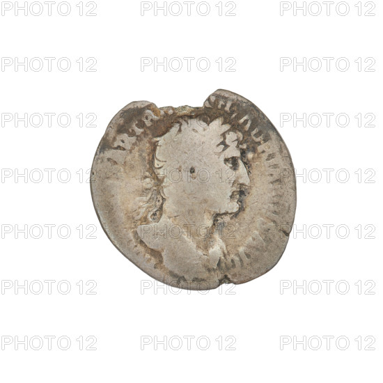 Denarius of Hadrian (76–138 CE; Roman emperor 117–138). Obverse: Bust of Hadrian with laurel wreath facing right; rim inscription: SARTRAIANHADRIANVSAVG. Reverse: Roma seated left on a chair, wearing a long robe and helmet, holding a figure of Victoria in her outstretched right hand and a vertical spear in her left, with a shield behind her; rim inscription: PM. Coin, Rome, Roman Empire (27 BCE–476 CE). Weight: 2.40 g. PM, III, 119–122.