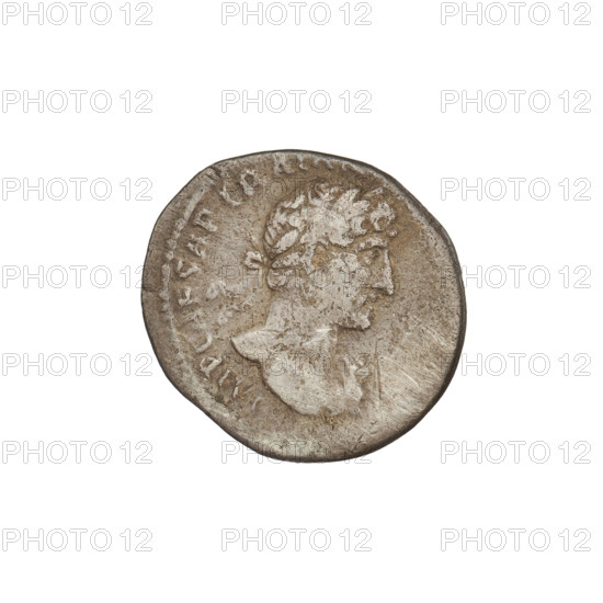 Denarius, Hadrian (76–138; Roman emperor 117–138). Obverse: Bust of Hadrian with laurel wreath facing right; rim inscription: IMPCAESARTRAIAN. Reverse: Roma seated left on a chair, wearing a long robe and helmet, holding a figure of Victoria in her outstretched right hand, a vertical spear in her left hand, a shield behind her; rim inscription: PM TR P COS III. Date: 119–122. Place: Rome, Roman Empire (27 BC–476). Medium: coin. Weight: 2.95 g.