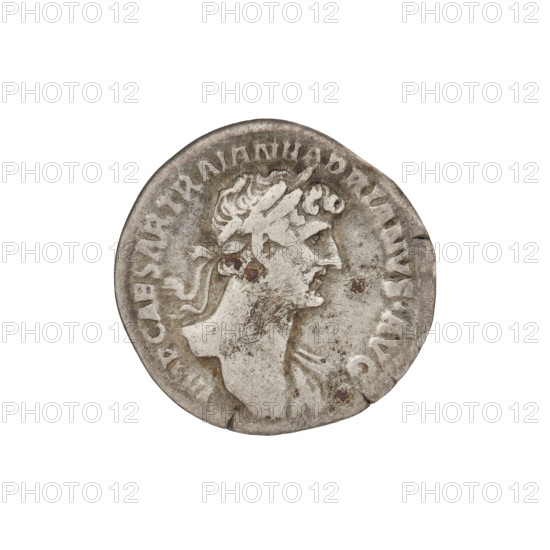 Denarius, Hadrian (76–138; Roman emperor 117–138). Obverse: Bust of Hadrian with laurel wreath facing right; rim inscription: IMPCAESARTRAIANHADRIANVSAVG. Reverse: Salus (personification) seated left, wearing a long robe; in her outstretched right hand she holds a patera from which she consecrates gifts on the lit altar in front of her, a snake entwined around the altar, her left hand rests on the back of a chair; rim inscription: PM TR P COS III; in the field: SALVS AVG. Date: 119–122. Rome, Roman Empire (27 BC–476). Coin; weight 3.15 g.