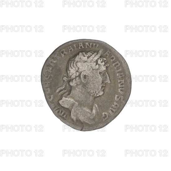 Denarius, Hadrian (76–138; Roman emperor 117–138). Obverse: Bust of Hadrian with laurel wreath facing right; rim inscription IMPCAESARTRAIANHADRIANVSAVG. Reverse: Salus seated left, wearing a long robe, holding a patera in her outstretched right hand consecrating offerings on a lit altar in front of her; a snake is entwined around the altar, her left hand rests on the back of a chair; rim inscription PM TR P COS III; field inscription SALVSAVG. Dated 119–122. Rome, Roman Empire (27 BC–476). Coin; weight 2.45 g.