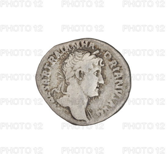 Denarius; Hadrian (76–138; Roman emperor 117–138). Obverse: bust of Hadrian with laurel wreath facing right; rim inscription. Reverse: Victoria flying right, wings raised, wearing a long robe, holding a trophy with both hands; rim inscription: PM TR P COS III. Date: 119–122. Rome, Roman Empire (27 BC–476). Coin; weight 2.90 g.