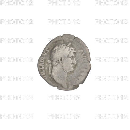 Denarius, Hadrian (76–138; Roman emperor 117–138). Obverse: head of Hadrian in laurel wreath facing right; rim inscription HADRIANVSAVG. Reverse: Roma seated on armour and shield facing right, wearing a short robe and helmet, spear in right hand and parazonium in left; rim inscription COSIII. 125–128 CE, Rome. Coin; weight 2.85 g.