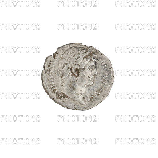 Denarius; Hadrian (76–138; Roman emperor 117–138). Obverse: head of Hadrian in laurel wreath facing right; rim inscription HADRIANVS AVGVSTVS. Reverse: Roma standing right, wearing a short robe and helmet, holding a spear in right hand and a parazonium in left; rim inscription COS III. Date: 125–128. Rome, Roman Empire (27 BC–476). Coin; weight 3.15 g.