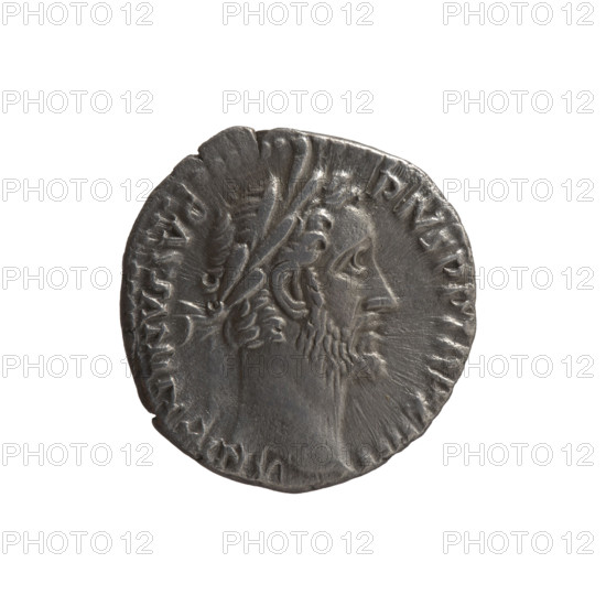 Denarius, Antoninus Pius (86–161; Roman emperor 138–161), issuer. Obverse: Head of Antoninus Pius in a laurel wreath facing right, inscription ANTONINVS AVG PIVS PP TR P XIIII. Reverse: Naked Genius stands frontally with head turned left, holding a patera in his right hand and ears of corn in his left, inscription COS IIII. Date: 150–151. Roman Empire; Rome. Coin. Diameter 16.0 mm; weight 3.05 g; axis 180°.