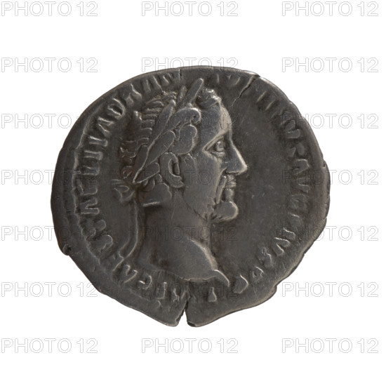 Denarius of Antoninus Pius (86–161; Roman emperor 138–161). Obverse: Head of the emperor in a laurel wreath facing right, inscription I P CAES T AEL HADR AN - ONINVS AVG PIVS PP. Reverse: Pietas stands to the right; with his right hand lowered he holds a fawn by the neck, in his left hand he holds a bowl of fruit above an altar, inscription TR POT XIIII - CO S IIII. Legend section: PIETA. Date: 150–151. Roman Empire (27 BC–476), Rome. Coin. Diameter 17.5–18.0 mm, weight 2.95 g, axis 180°.