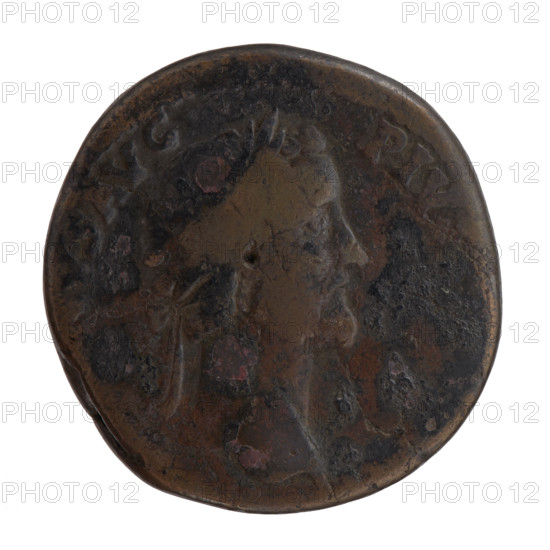 Sestertius, Antoninus Pius (86–161; Roman emperor 138–161). Obverse: head of Antoninus Pius in a laurel wreath facing right, inscription NVS AVG - PIVS. Reverse: Annona stands to the right with one foot on the prow of a ship, holding a long rudder in her right hand and a modius (container with ears of grain) in her left; inscriptions TR POT, X - , S IIII; control marks SC in fields. Date: 156–157. Roman Empire, Rome. Coin; diameter 29.5–30.5 mm, weight 24.90 g, axis 0°.