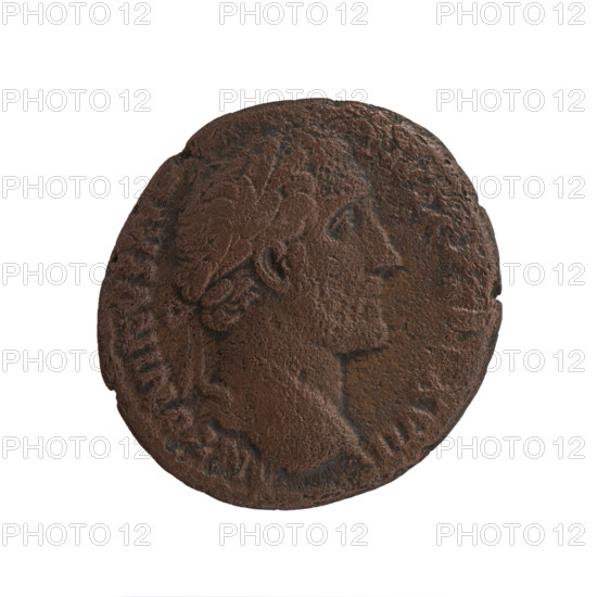 Antoninus Pius (86–161; Roman emperor 138–161), issuer. Obverse: Head of Antoninus Pius in a laurel wreath facing right, legend ANTONINVS AVG PIVS P, XVII around. Reverse: Annona (personification) stands to the right, rests her right hand on a container (modius) placed on a low pedestal (cippus), holds a branch in her left hand above a basket of fruit, legend ANN A AVG IIII around, in SC fields. Date: 153–154. Roman Empire, Rome. Coin; diameter 25.5 mm, weight 11.00 g, axis 180°.