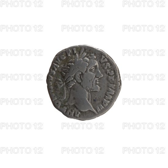 Denarius, Antoninus Pius (86–161; Roman emperor 138–161). Obverse: head of the emperor in a laurel wreath to the right, inscription ANTONINVS AVG PIVS PP IMP II. Reverse: Annona personified stands to the right with one leg on the prow of a ship, holding a long rudder in her right hand and a container with ears of corn (modius) in her left, inscription TR POT X X COS IIII. Date: 156–157. Roman Empire (27 BC–476). Coin; diameter 16.5 mm; weight 3.10 g; axis 195°.