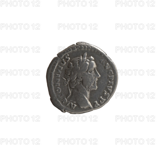 Denarius of Antoninus Pius (86–161; Roman emperor 138–161). Obverse: Head of Antoninus Pius with a laurel wreath facing right, inscription ANTONINVS • AVG • PIVS • PP. Reverse: Emperor in toga and veil standing left, holding a patera above a tripod in his right hand and a scroll in his left, inscription VOTA • SVSCE • PTA • DEC • III; legend includes COS IIII. Iconography: emperor with a veil, laurel wreath, tripods, scrolls, veils, paterae. Roman Empire, 157–159. Coin: diameter 18.0–18.5 mm, weight 3.10 g, axis 180°.