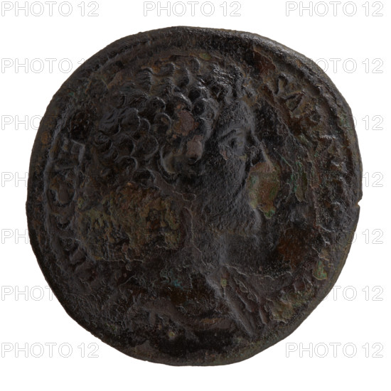 Sestertius; obverse: head of young Marcus Aurelius bare to right, inscription LIVS CAE - SAR AVG P, OS II around; reverse: Minerva stands right, holds a spear in her raised right hand, rests her left hand on a shield standing on the ground, no circumferential legend, fields S - C, 145–147. Roman Empire (27 BC–476); Roman coin; issuer: Antoninus Pius; Marcus Aurelius (121–180; Caesar 139–161; emperor 161–180) — iconography; Minerva (myth.); shields, spears. Coin diam. 31.0–31.5 mm; weight 24.95 g; axis 330°.