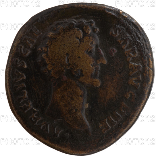 Sestertius, ca. 148–149 CE. Obverse: head of young Marcus Aurelius, bare, facing right; legend AVRELIVS CAE SAR AVG PII F. Reverse: Pietas standing left, extending her right hand over a child at her side and holding a long scepter in her left; legend TR POT III (fragmentary). Antoninus Pius (reign 138–161) and Marcus Aurelius (caesar 139–161; emperor 161–180) depicted; iconography includes Pietas, scepter, child. Roman, minted in Rome. Bronze coin, diameter ~33.5–34.0 mm, weight 27.4 g, axis 180°.