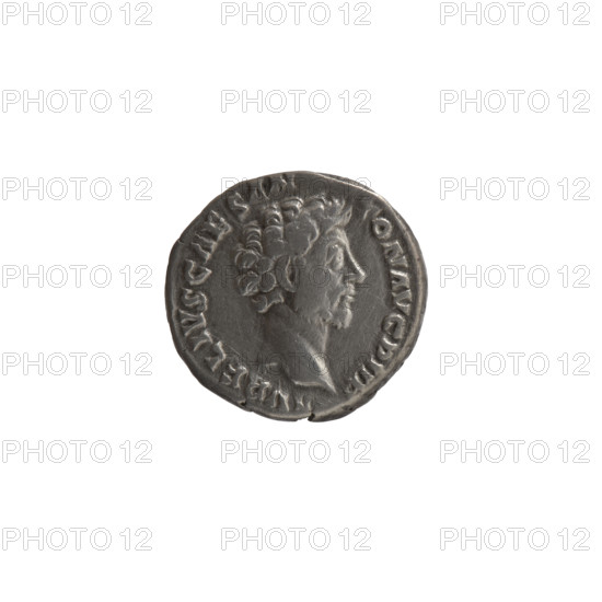 Denarius, Marcus Aurelius (121–180; Roman emperor 161–180), caesar 139–161; Antoninus Pius (86–161; Roman emperor 138–161) — issuer. Iconography: personifications, Virtus (personification); spears; parazonium (attribute). Obverse: head of young Marcus Aurelius without a cap to the right; inscription AVRELIVS CAES ANTON AVG PII F all around. Reverse: Virtus standing left, holding a parade dagger (parazonium) in his right hand and a spear with the head down in his left; inscription R POT X – COS II all around. Date: 156–157. Culture/place: Roman Empire, Rome. Object type: coin (denarius). Dimensions: diameter 16.0–16.5 mm, weight 3.35 g, axis 180°.
