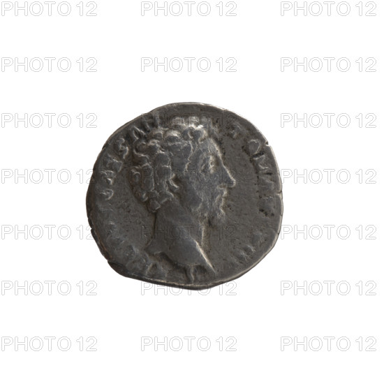 Denarius, Marcus Aurelius (121–180; Roman emperor 161–180), issued under Antoninus Pius (86–161; Roman emperor 138–161). Obverse: head of Marcus Aurelius without a cap to the right, inscription RELIVS CAES AN-TON AV, PII F around. Reverse: Spes walking to the left, holding a flower in his right hand and lifting the hem of his robe with his left hand, inscription TR POT X-II-COS II around. Date: 157–158. Roman Empire, Rome. Coin; diameter 16.0–16.5 mm, weight 2.80 g, axis 165°.
