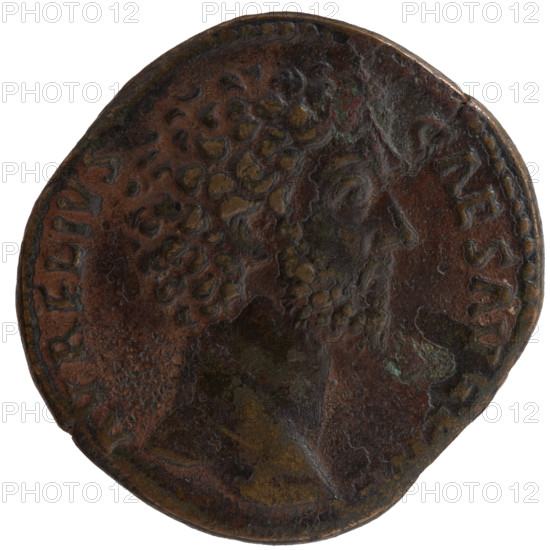 Sestertius, Marcus Aurelius (121–180; Roman emperor 161–180), issued during reign of Antoninus Pius (86–161; Roman emperor 138–161); ca. 158–159. Obverse: Head of Marcus Aurelius without a cap, facing right; inscription AVRELIVS - CAES AVG PII F. Reverse: Virtus personified stands right with his left foot on a lying helmet, holding a spear pointed down in his right hand and a parade dagger (parazonium) in his left; inscriptions TR P, T XIII - COS II, in SC fields. Iconography: personifications, helmets, parazonium, spears. Roman Empire, Rome. Coin: diameter 31.0–31.5 mm, weight 21.95 g, axis 330°.