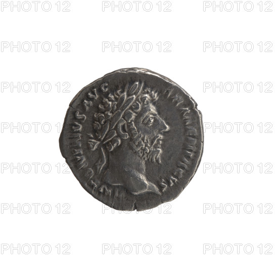 Denarius, Marcus Aurelius (121–180; Roman emperor 161–180), issuer Marcus Aurelius. Obverse: Head of Marcus Aurelius with laurel wreath to the right, inscription NERVS AVG (NT, NINVS AVG noted). Reverse: Armenia personified, short robe, trousers and pointed cap, seated left, supporting her head with her right hand, left hand resting on a bow and quiver, a shield and a standard (vexillum) in front; inscriptions PM TR P XVIII IMP II COS III, in section ARMEN. Date: 163–164. Roman Empire, Rome. Coin; diameter 17.0 mm, weight 3.24 g, axis 180°. Icons: personification, quivers, shields, bows, vexillum; iconography of Marcus Aurelius and Armenia.