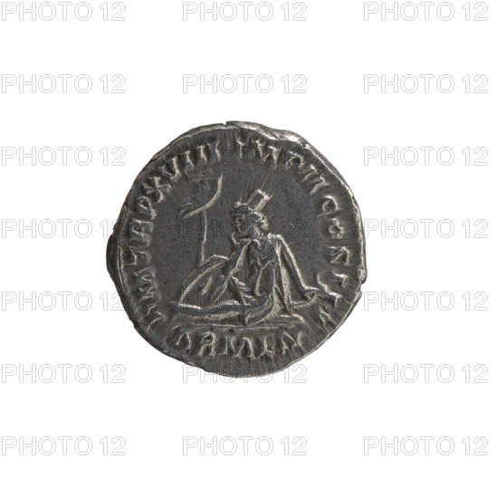 Denarius, Marcus Aurelius (121–180; Roman emperor 161–180) (issuer). Obverse: Head of Marcus Aurelius with laurel wreath to the right, inscription 'NT NINVS AVG' (sic). Reverse: Armenia personified—short robe, trousers, pointed cap—seated left, supporting her head with her right hand, left hand resting on a bow and quiver; shield and vexillum in front; inscription 'PM TR P XVIII IMP II COS III' and in section 'ARMEN.' Date: 163–164. Roman Empire (27 BC–476), Rome. Coin; diameter 17.0 mm, weight 3.24 g, axis 180°.