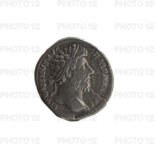Denarius, Marcus Aurelius (121–180; Roman emperor 161–180) — obverse: head of Marcus Aurelius with laurel wreath to the right, inscription 'ANTONINVS AVG'; reverse: personification of Armenia in a short robe, trousers and pointed cap, seated left, supporting her head with her right hand, left hand resting on a bow and a quiver, a shield and a standard (vexillum) in front; inscriptions 'PM TR P XVIII IMP II COS III' and 'ARMEN.'; episode ARMEN., dated 163–164; Roman Empire (27 BC–476), Rome; coin (denarius), weight 2.80 g, diameter 16.0–18.0 mm, axis 180°.