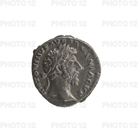 Denarius, Marcus Aurelius (121–180; Roman emperor 161–180), issuer; obverse: head of Marcus Aurelius with laurel wreath facing right, inscription ANTONINVS AVG ARMENIACVS; reverse: personification of Armenia in a short robe, trousers and a pointed cap seated left, supporting her head with her right hand, left hand resting on a bow and quiver, with a shield and a standard (vexillum) in front; inscriptions PM, R, X, I IMP II COS and ARMEN.; dated 163–164; Roman Empire, Rome; coin (silver), weight 3.12 g, diameter 16.0–17.0 mm, axis 0°.